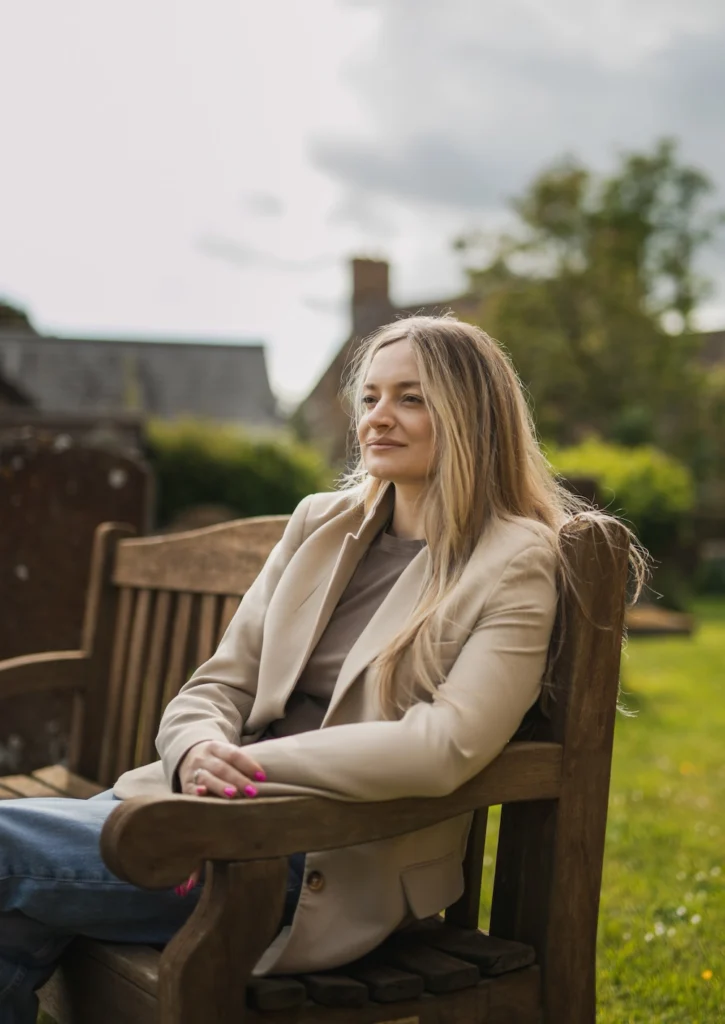 Woman Sitting on a Wooden Bench
